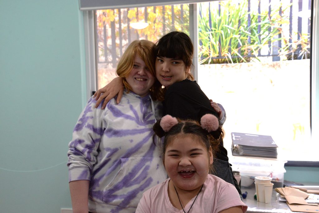 Rocky Bay School Holiday program Art class 3 girls smiling for a group photo