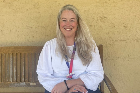 Rocky Bay staff member Amy, sitting on a bench