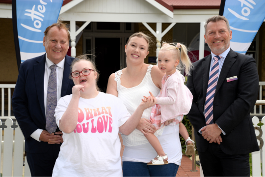 The Minister for Disabilities, Rocky Bay CEO and customers posing for a photo outside Lady Lawley Cottage.